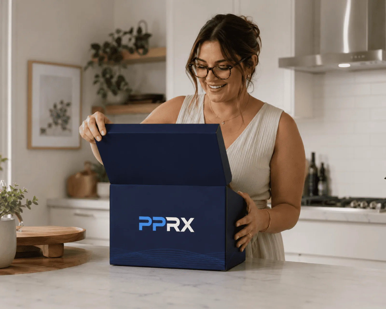 A smiling PPRX patient opening her navy treatment box on the kitchen counter